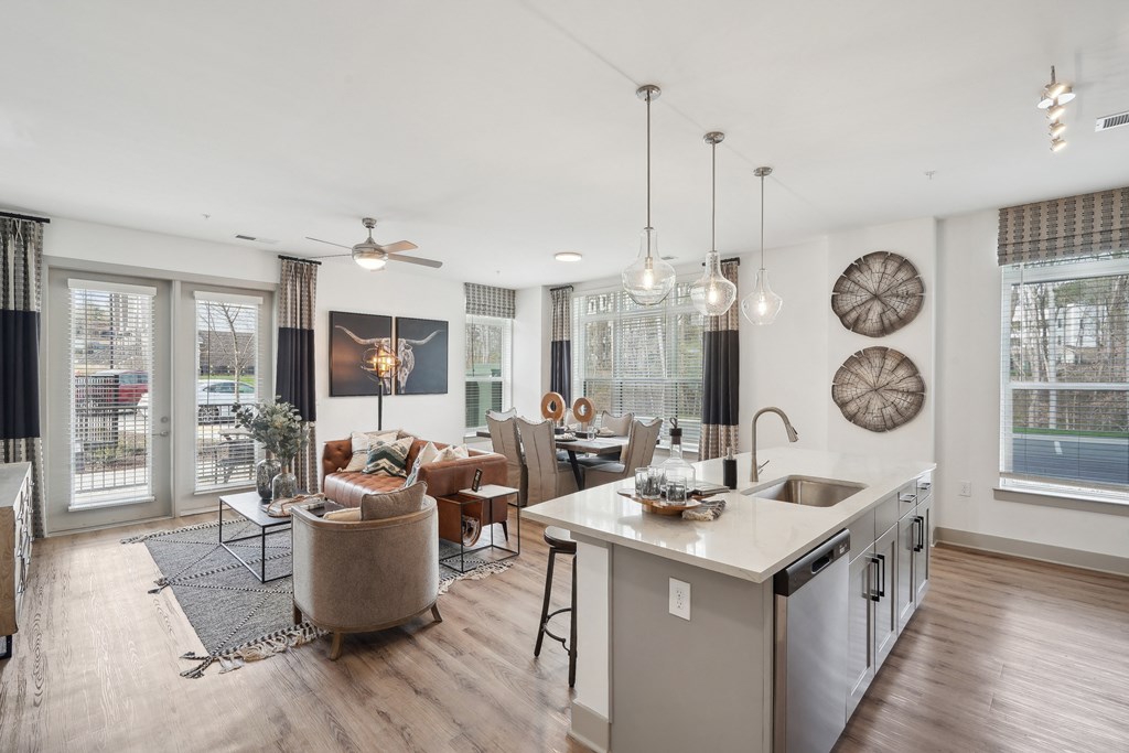 a living room with a kitchen and a dining room