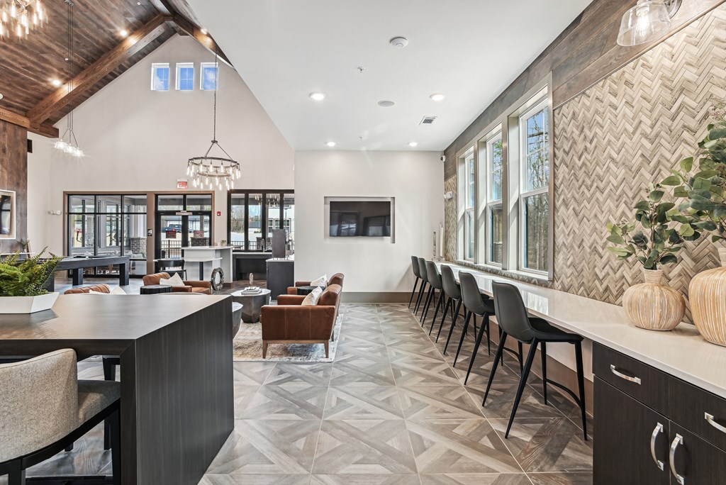 the preserve at cardinal woods lobby with tables and chairs and a bar