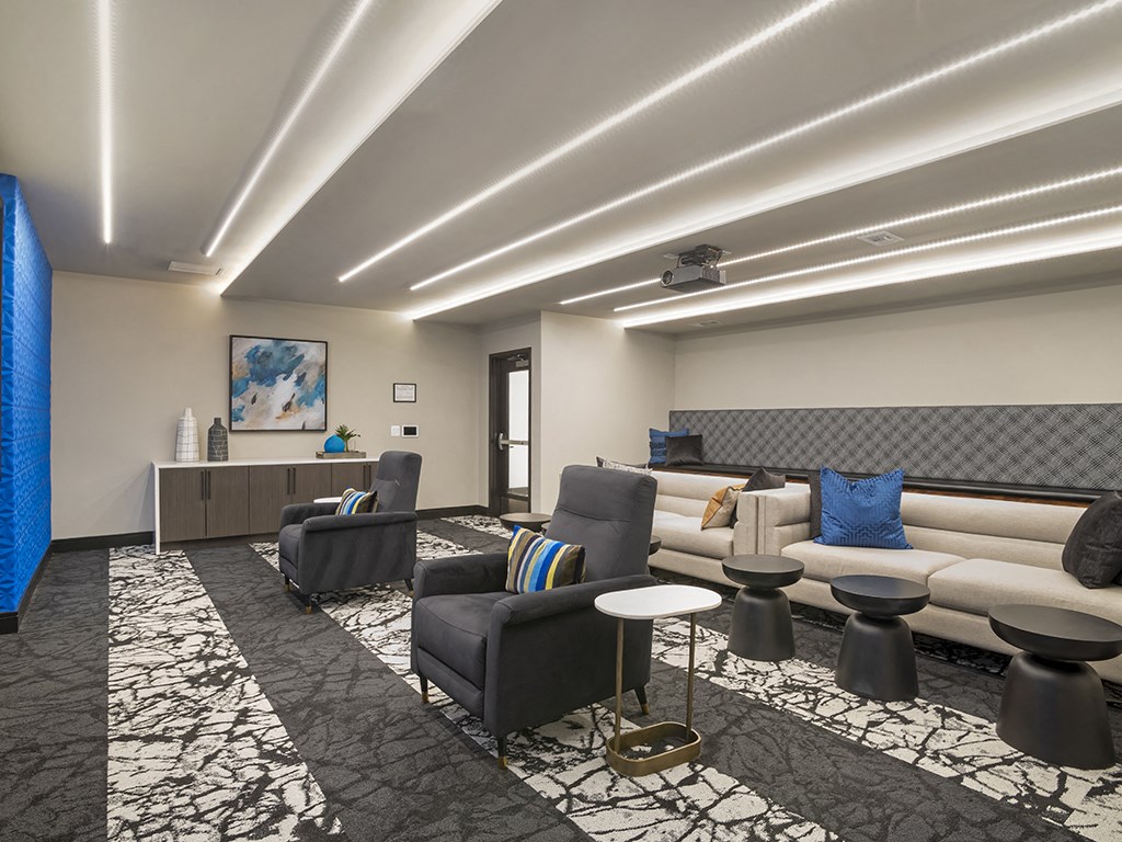 A modern living room with a black and white patterned carpet.