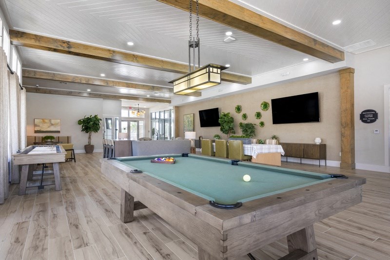 a pool table in the resident clubhouse at the villas at falling waters in west omaha