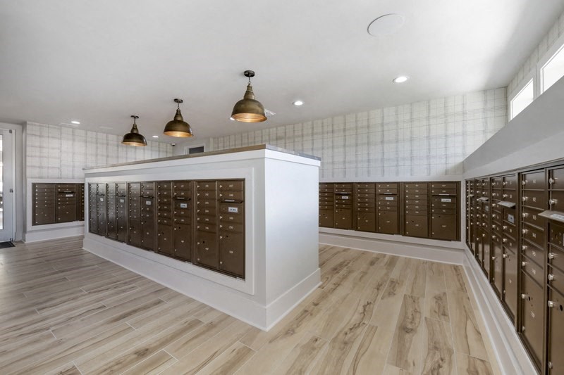 a locker room with wooden floors and white walls