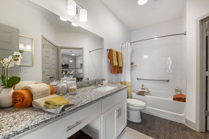 a bathroom with a bathtub and a sink