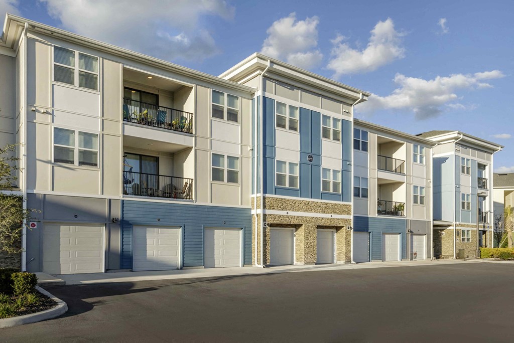 an exterior view of an apartment building with blue and white walls