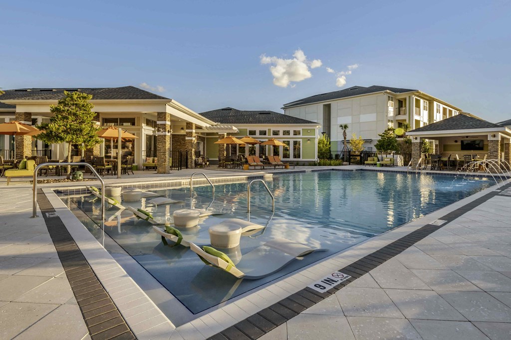 a swimming pool at the resort on a sunny day