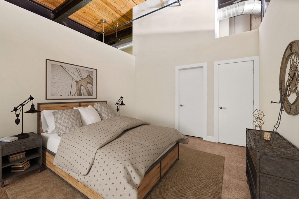 a bedroom with a bed and a dresser