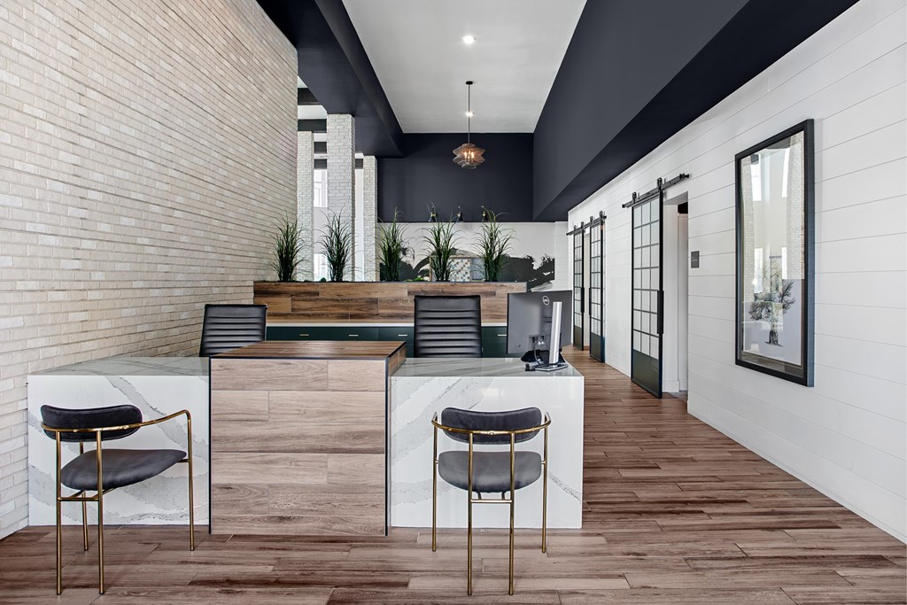 A modern kitchen with a bar area and seating.