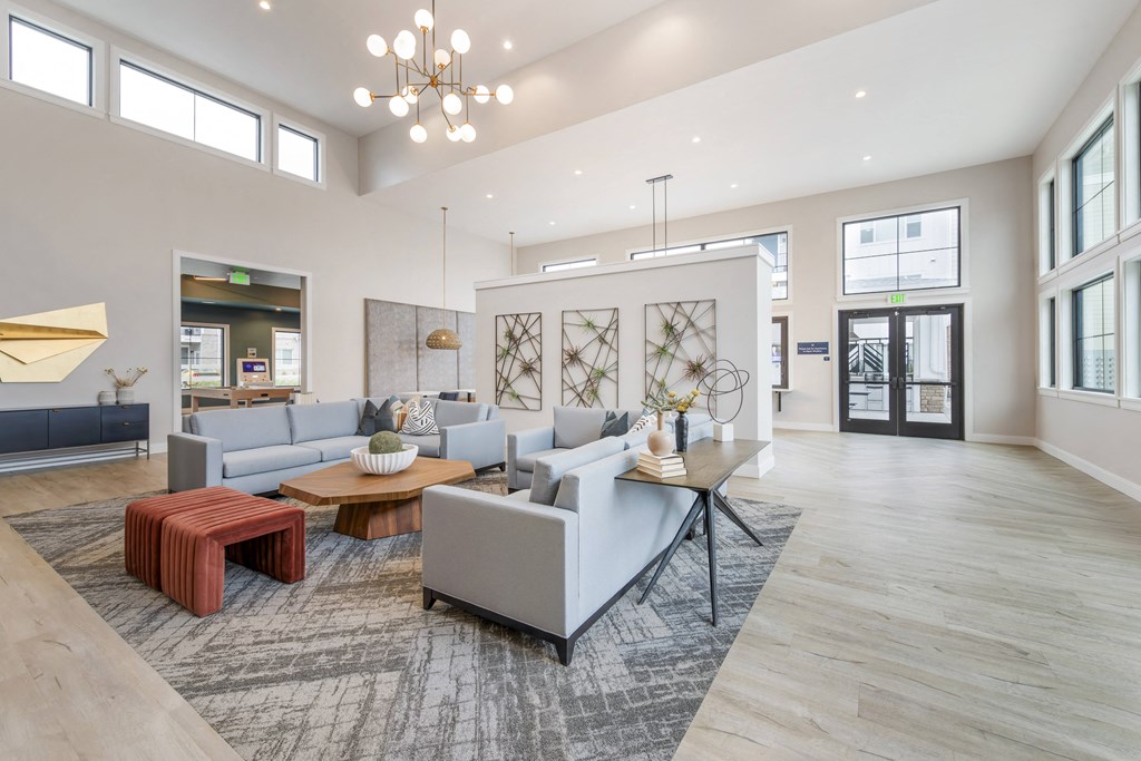 a large living room with couches and a table