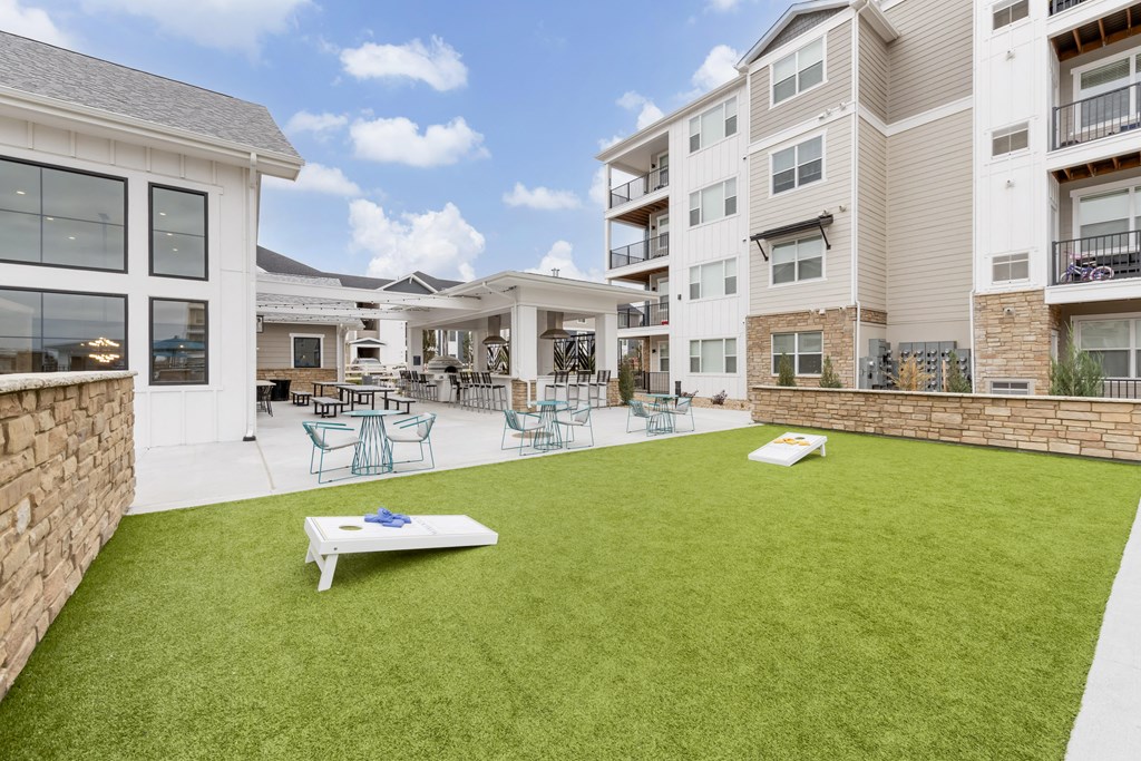 the backyard at the preserve at ballantyne commons with lawn and tables and chairs