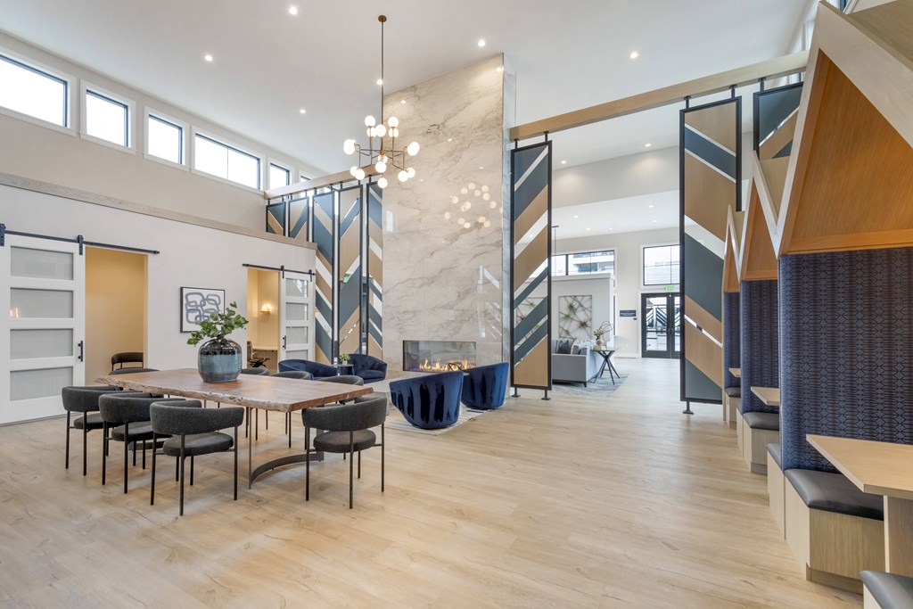 a dining room with a table and chairs and a fireplace