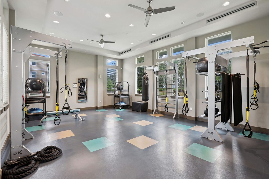 the home gym has plenty of equipment and space to workout
