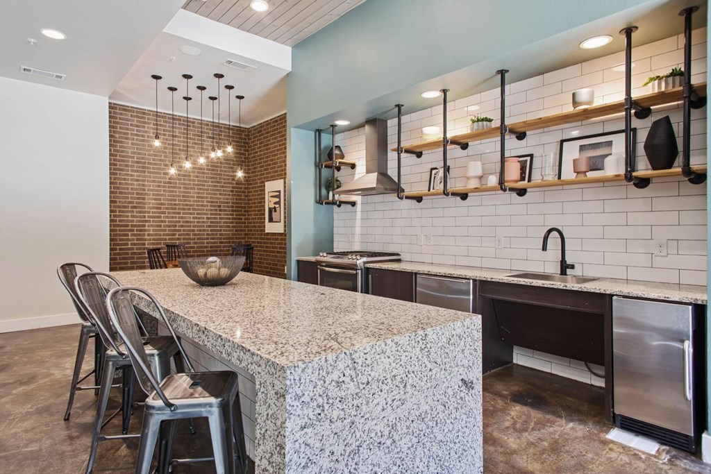 a kitchen with a counter top and a sink