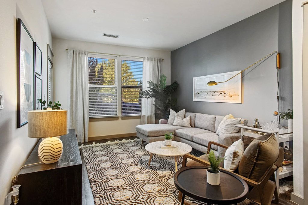 a living room with a couch and a table