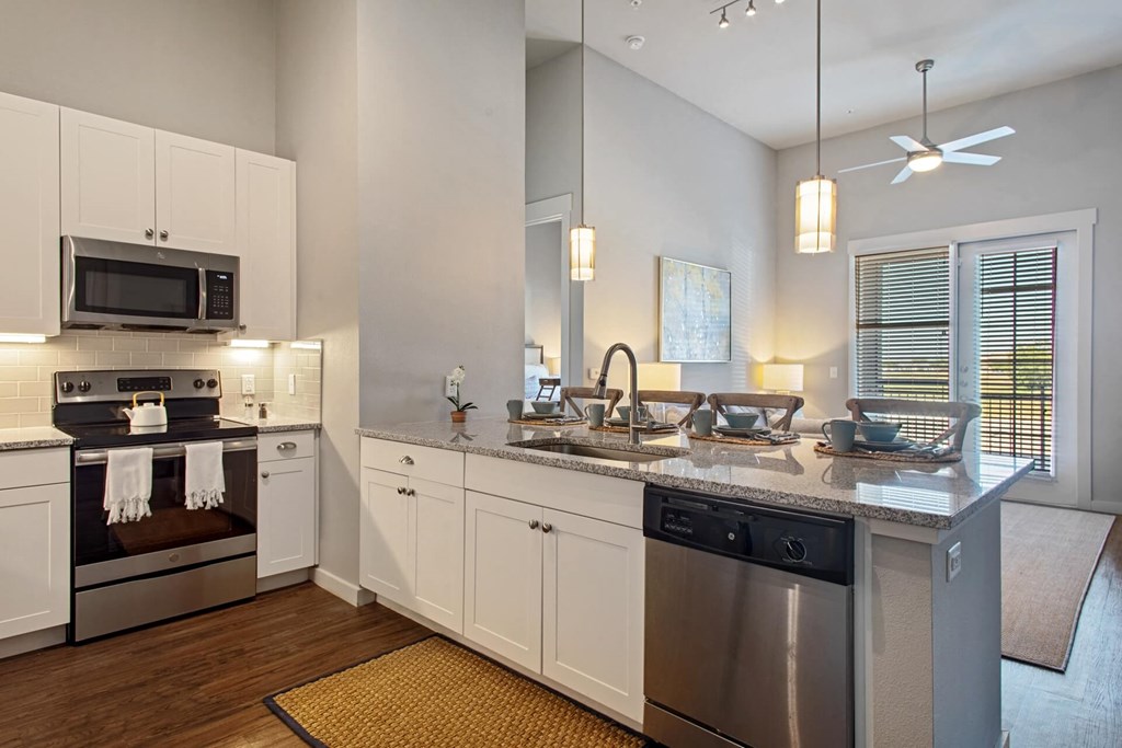 a kitchen with a counter top and a sink
