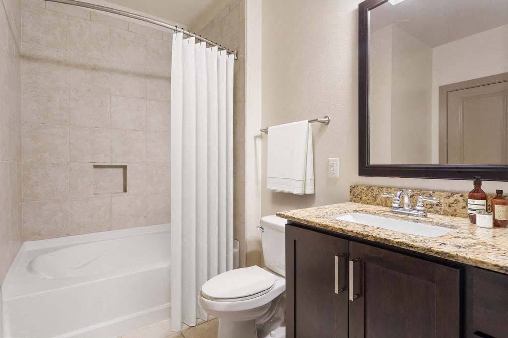 a bathroom with a sink toilet and a shower