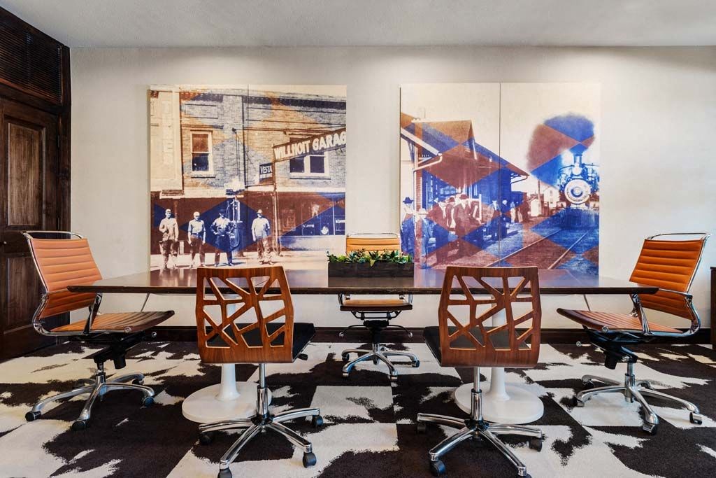 a conference room with a table and chairs