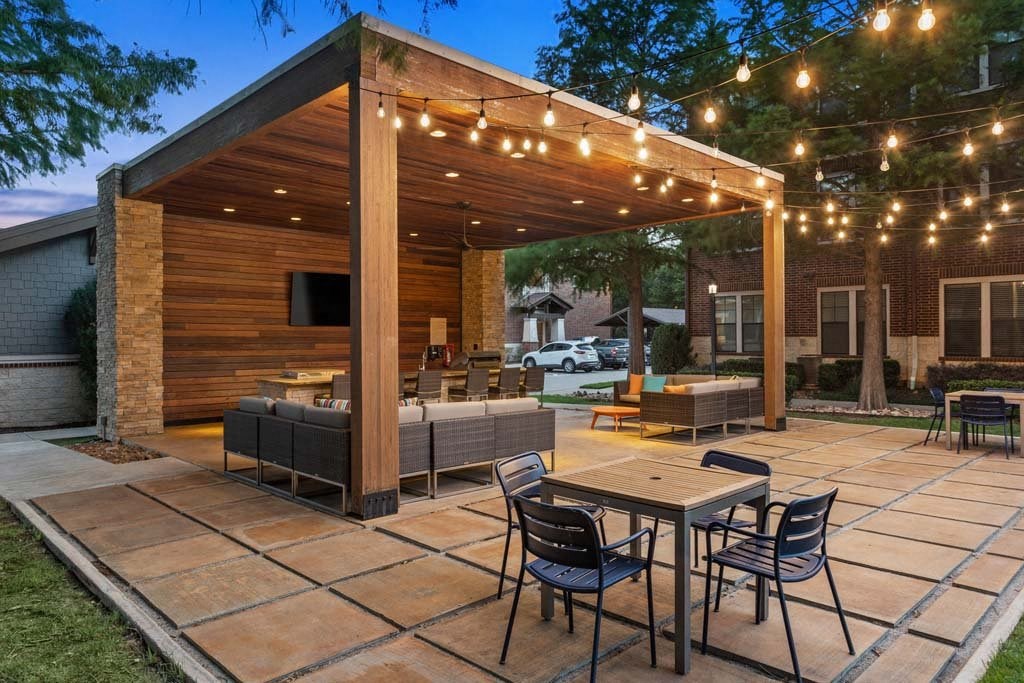 a patio with a table and chairs under a patio