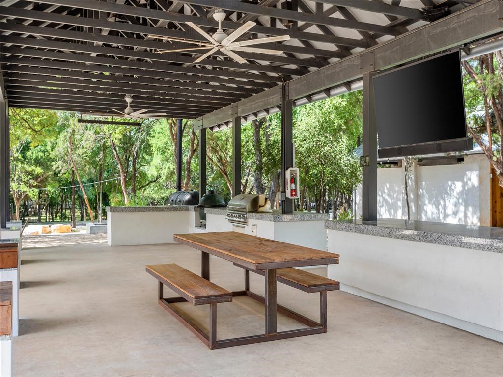 a picnic area with a table and a television