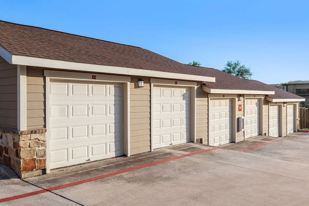 a row of garage doors on the side of a building