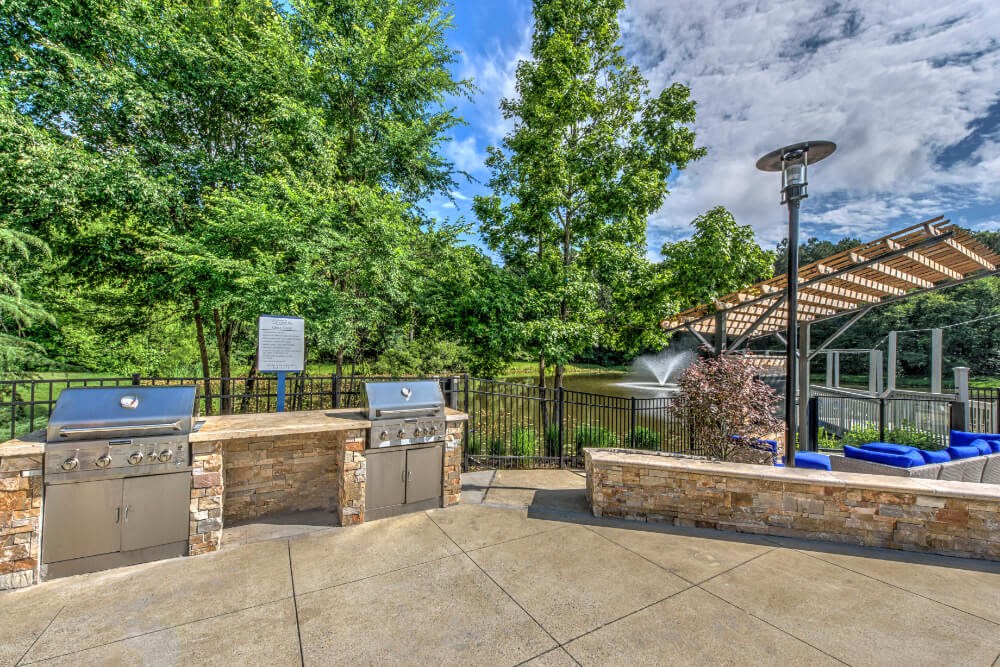 a patio with a grill and a barbecue area