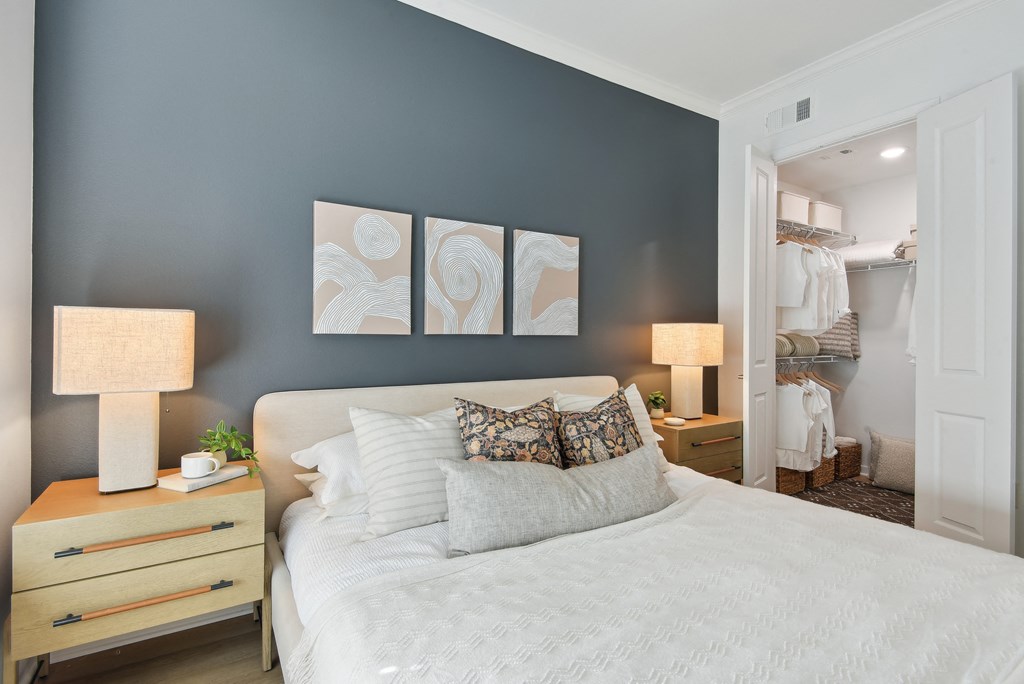 a bedroom with a bed and a closet