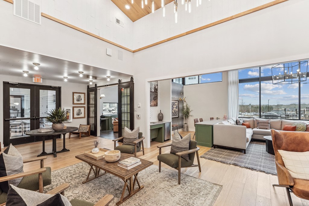 a living room with a large window view of a city
