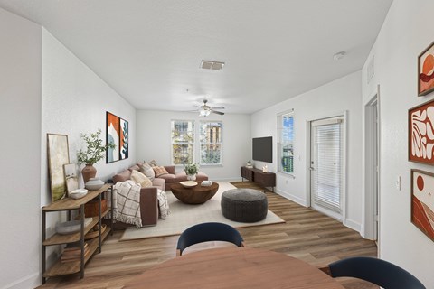 A living room with a brown table and a blue chair.