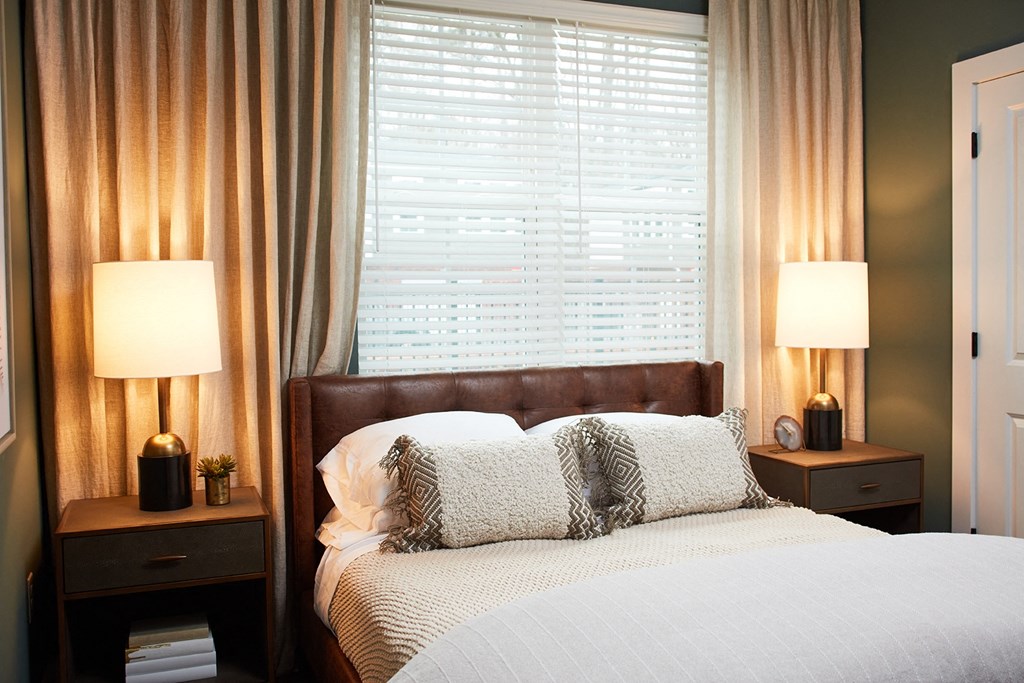 bedroom with queen sized bed and nightstands
