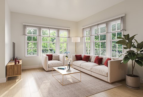 A living room with a white couch and a coffee table.