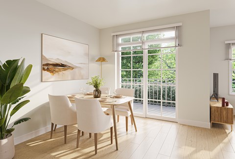 A dining room with a table set for two and a painting on the wall.
