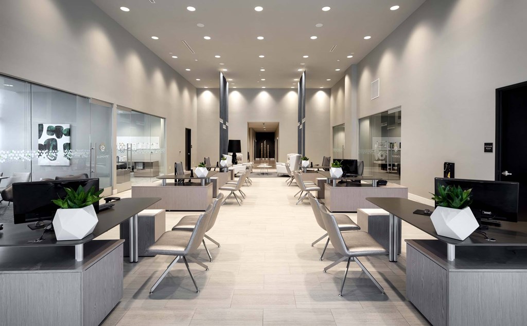 A modern office space with sleek furniture and a neutral color scheme.