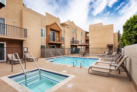 A swimming pool with a slide in the middle of it.