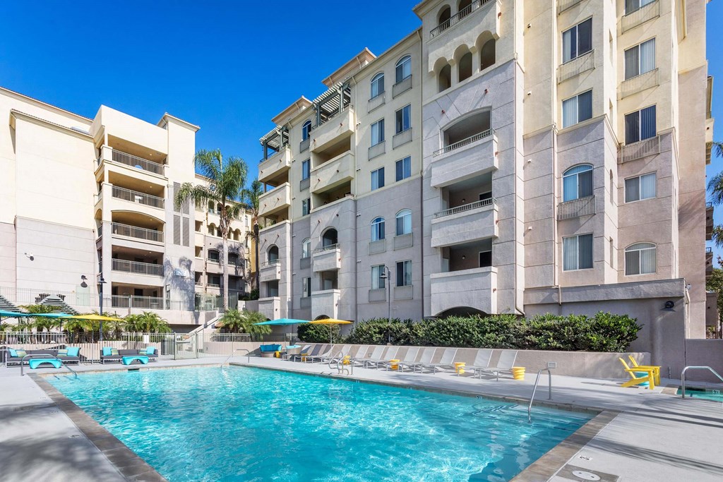 A swimming pool in front of apartment buildings. at La Jolla Crossroads Apartments, San Diego, California