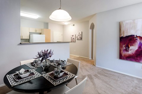 Dining area with modern table setting and artwork at La Jolla Crossroads Apartments, California, 92122