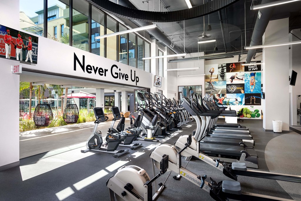 A gym with a sign that says Never Give Up.
