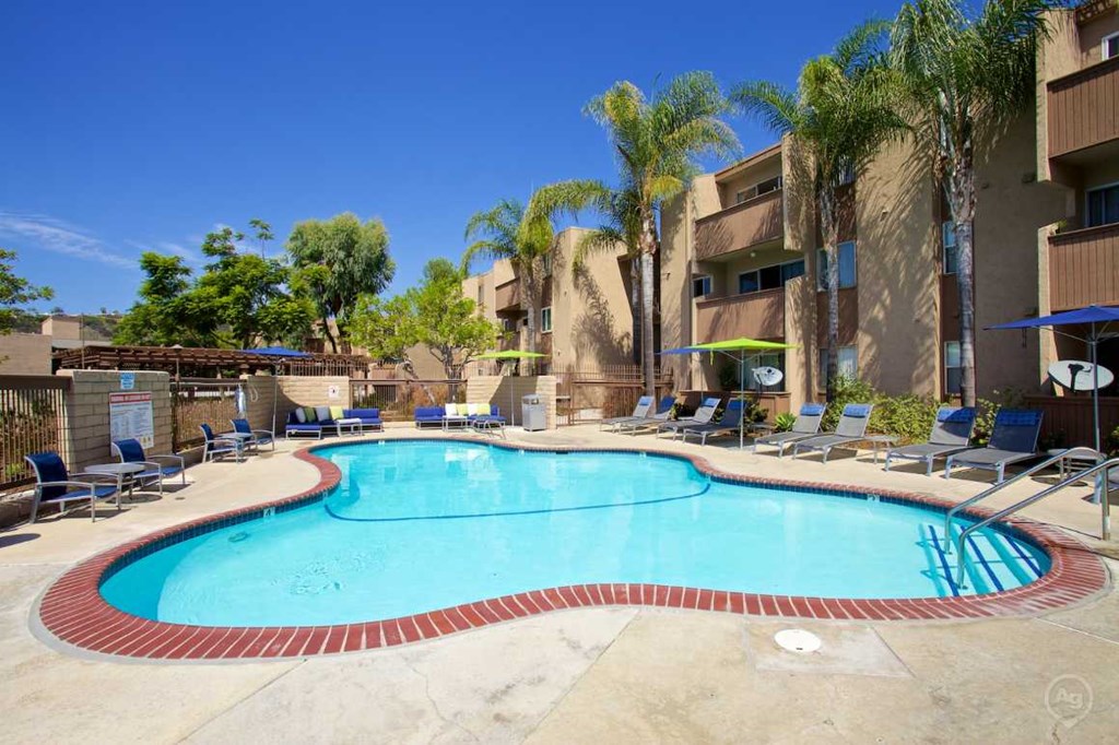 A large outdoor swimming pool at Pacific Bay Club Apartments, San Diego