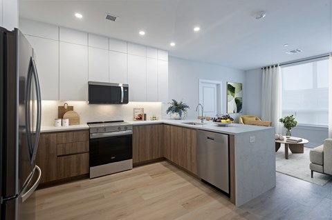 A modern kitchen with wooden cabinets and stainless steel appliances.