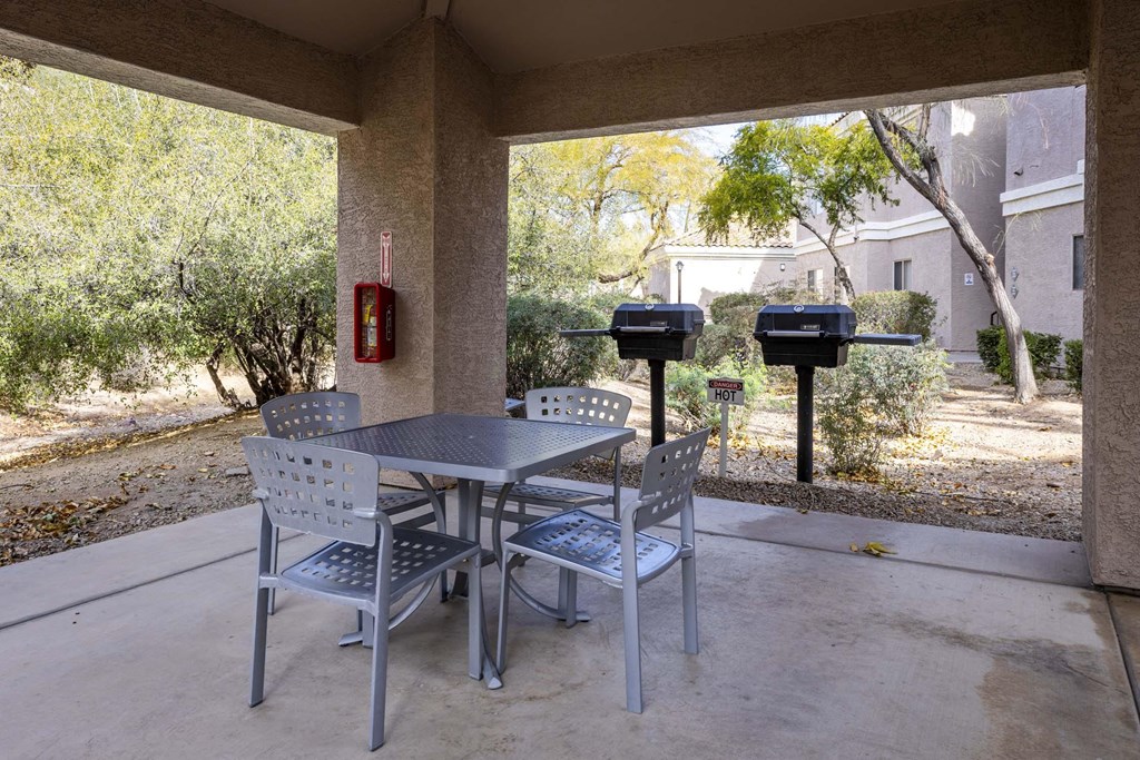 A patio with a table and chairs and a mailbox.at Vintage at Scottsdale, SCOTTSDALE, AZ 85260