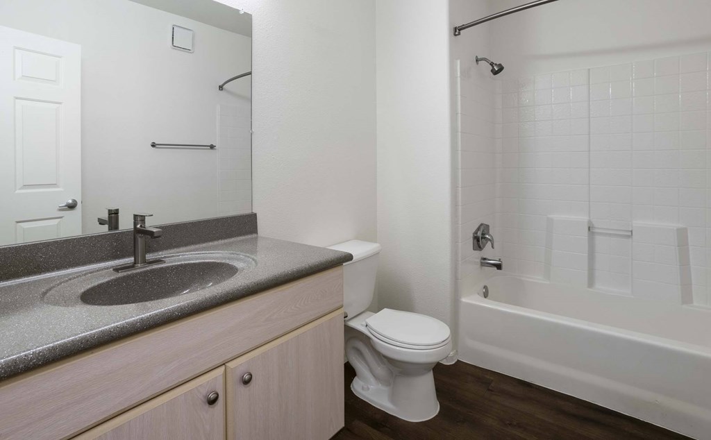 A bathroom with a toilet, sink, and bathtub.at Vintage at Scottsdale, SCOTTSDALE Arizona