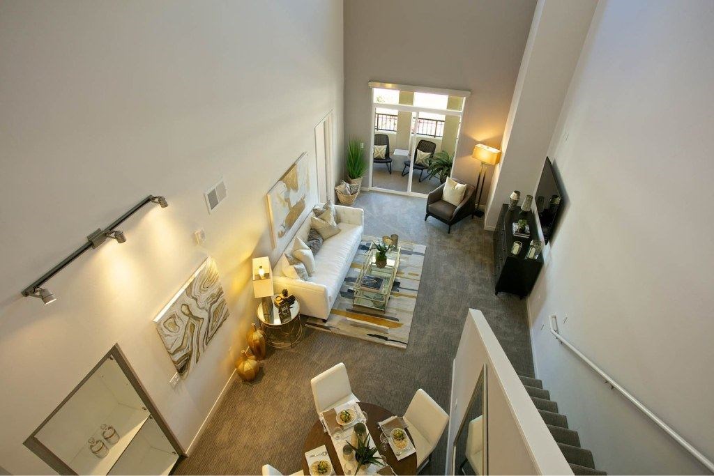 A living room with a couch, chairs, and a coffee table.