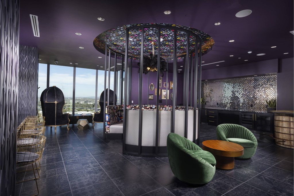 A modern interior with a purple ceiling and a large circular chandelier. at LUX by Garden*, San Diego, California