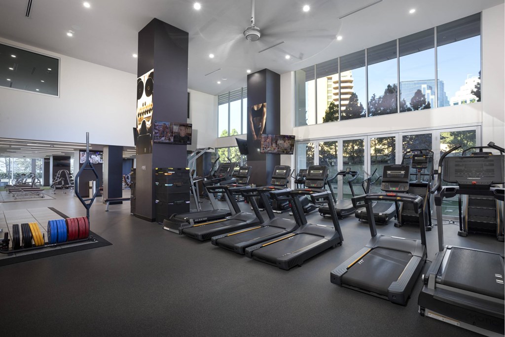 A gym with treadmills and exercise equipment. at LUX by Garden*, San Diego