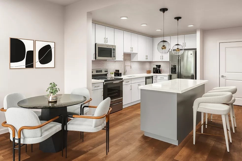 A modern kitchen with a dining table and chairs.at Volar Apartments, Irvine