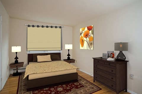 A bedroom with a bed, two nightstands, and a rug.