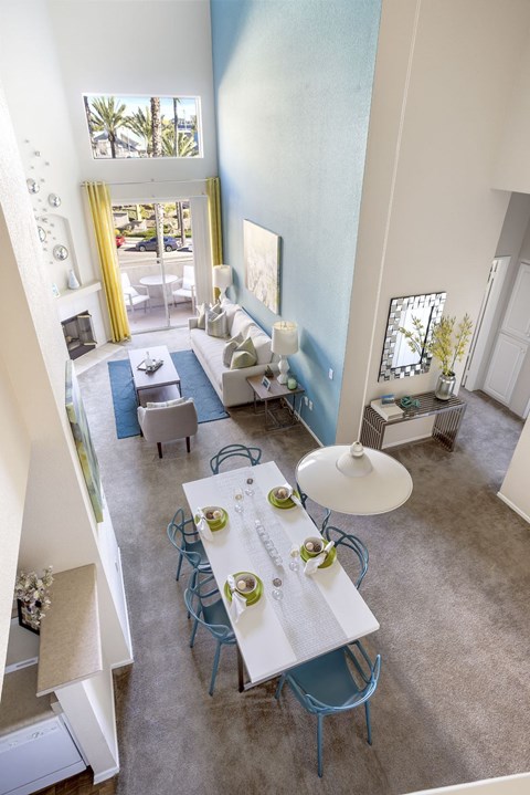 A dining room with a table set for two.at Costa Verde Village Apartments, San Diego California