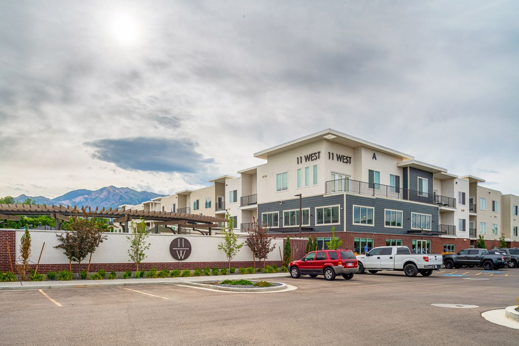a large building with a parking lot in front of it