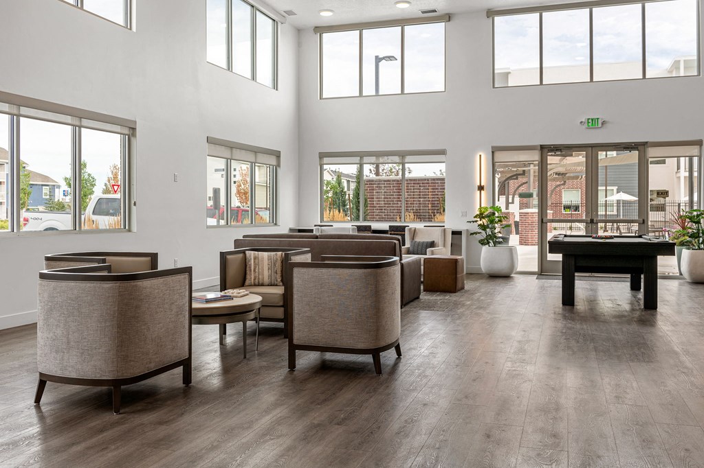 an open living room with a foosball table and couches