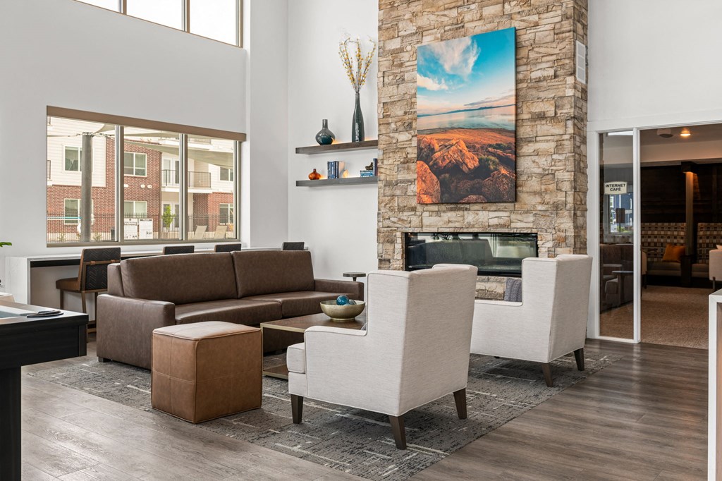 a living room with a fireplace and a large window