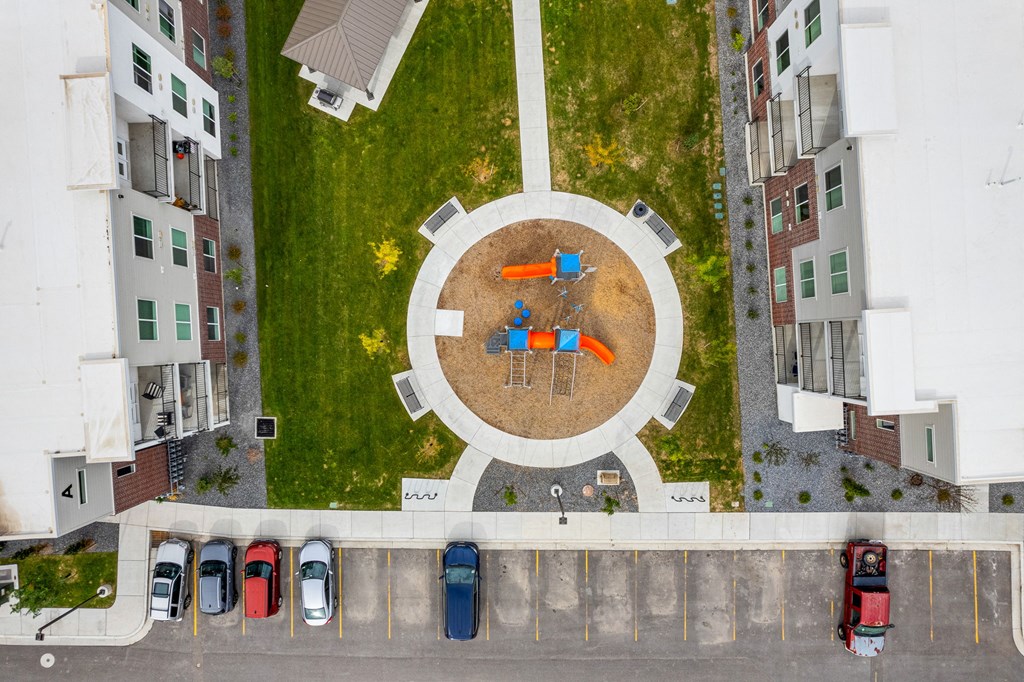 a birdseye view of a park with a circular seating area