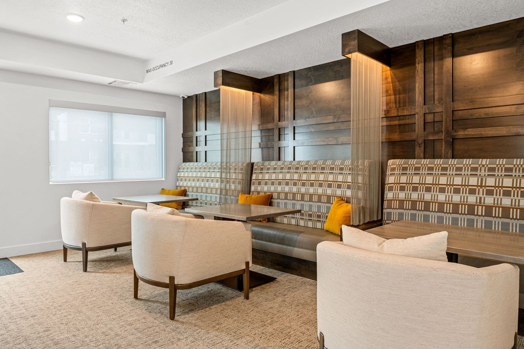 a seating area with couches and chairs