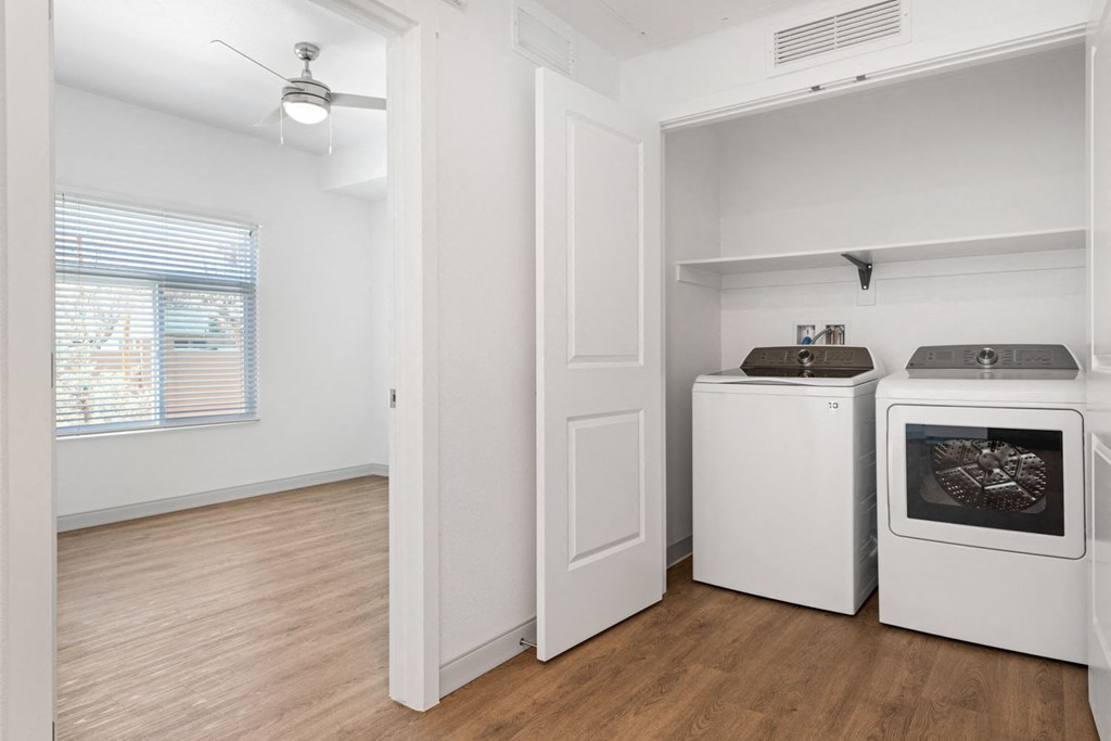 a laundry room with a washer and dryer